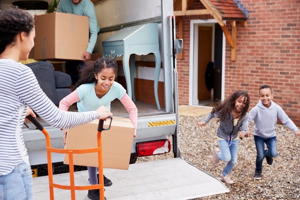 Children helping their mom move.