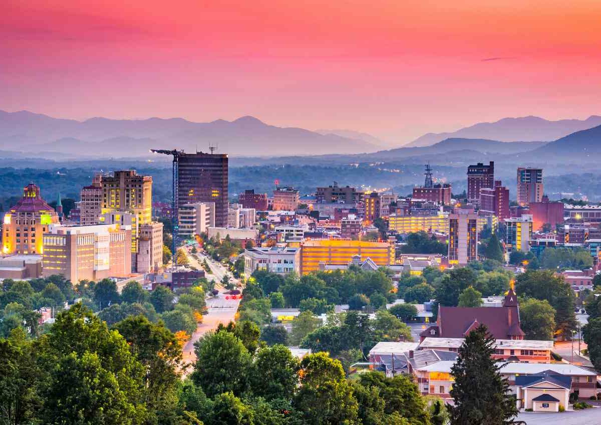 An aerial shot of downtown Asheville, NC at dusk